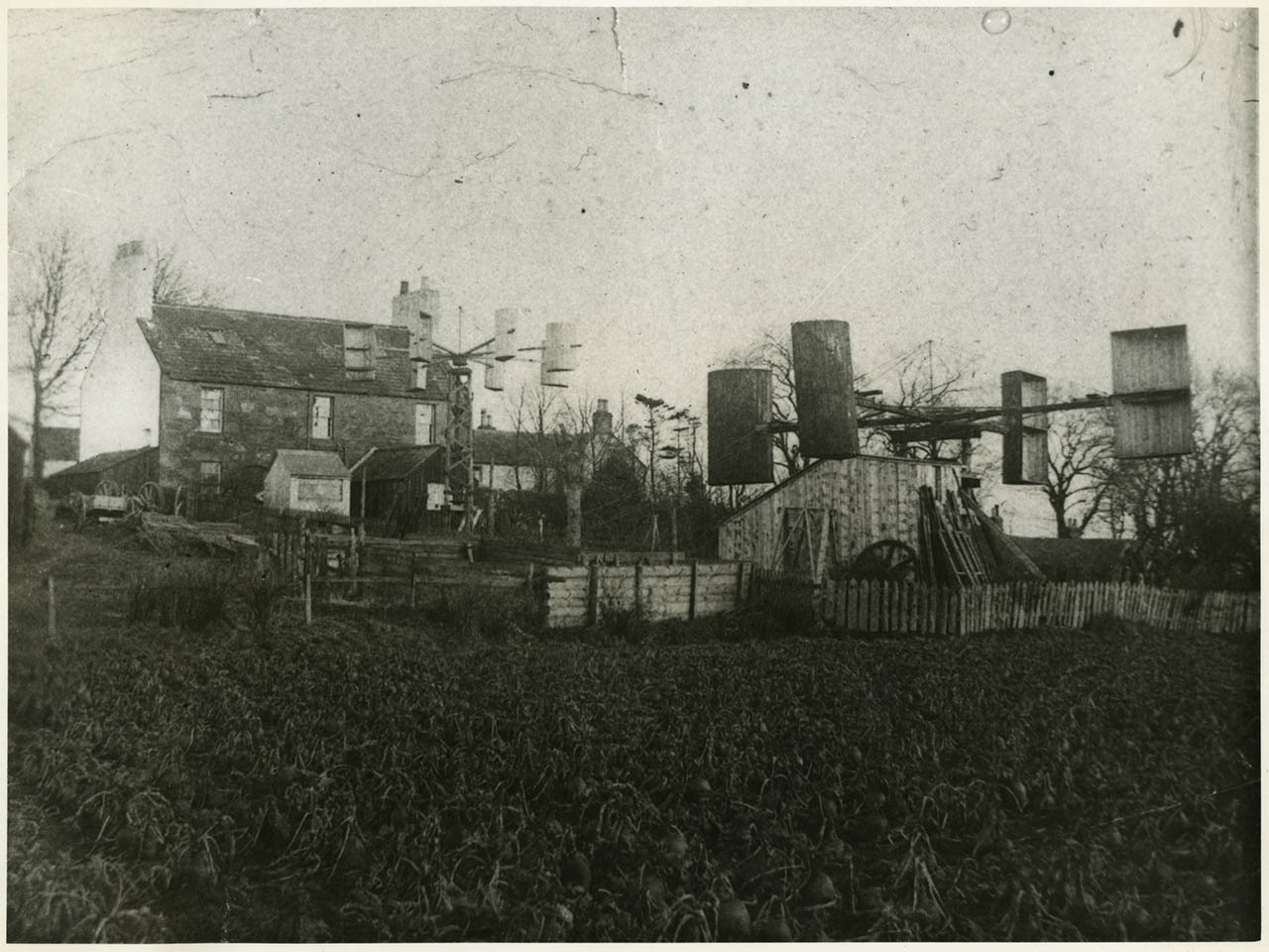 Two windmills erected in the garden of James Blyth’s cottage at Marykirk, c.1892 